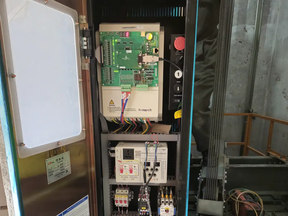 Motor drive and control cabinet being repaired and commissioned